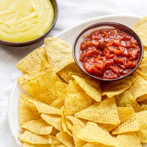 Tortilla-Chips-with-Salsa-Dip-and-Shredded-Cheese